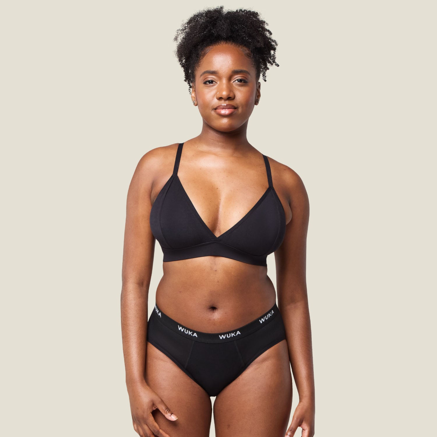 Model wearing WUKA Ultimate™ Midi Brief - Medium flow period pants, offering stylish comfort and reliable protection for everyday wear.