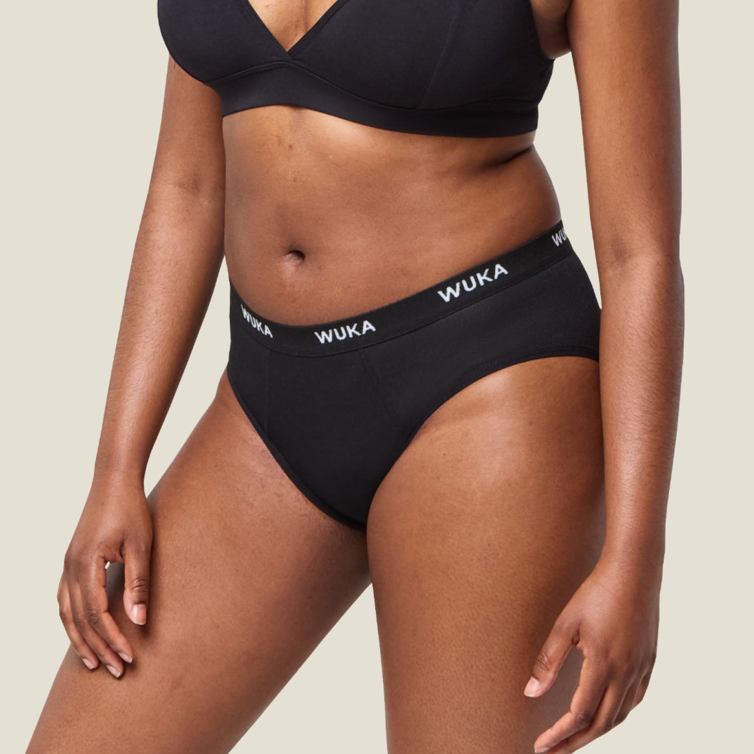 Side profile of WUKA Ultimate™ Midi Brief - Medium flow period pants, designed for comfort, coverage and leak-free movement.