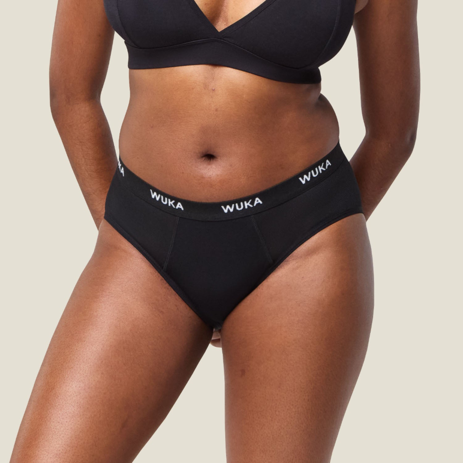 Close-up front view of WUKA Ultimate™ Midi Brief Super Heavy Flow period pants, showcasing the high-absorbency design and branded waistband.