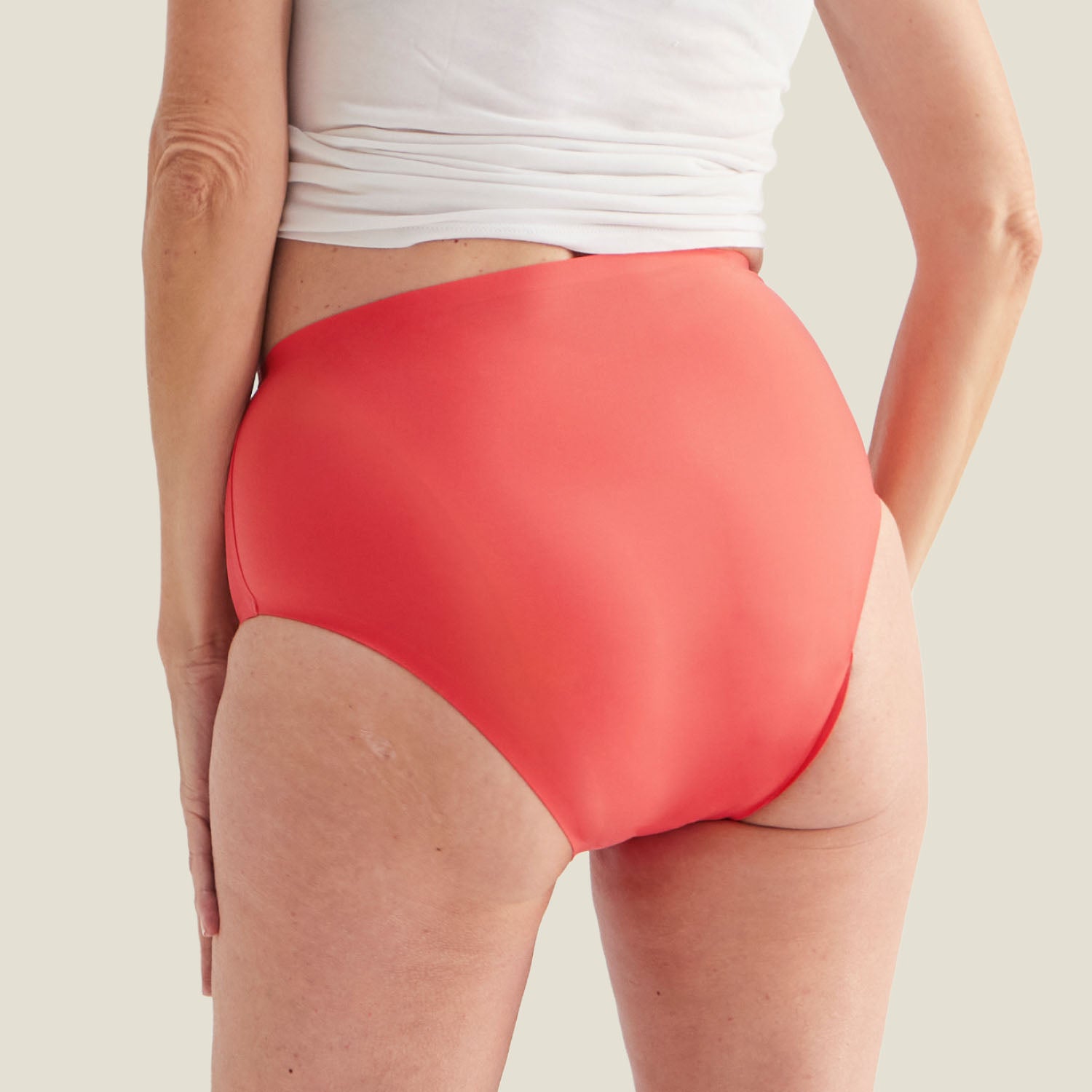 Back view of the Coral Pink Drytech™ Incontinence Midi Brief highlighting its full coverage and smooth finish for everyday confidence.