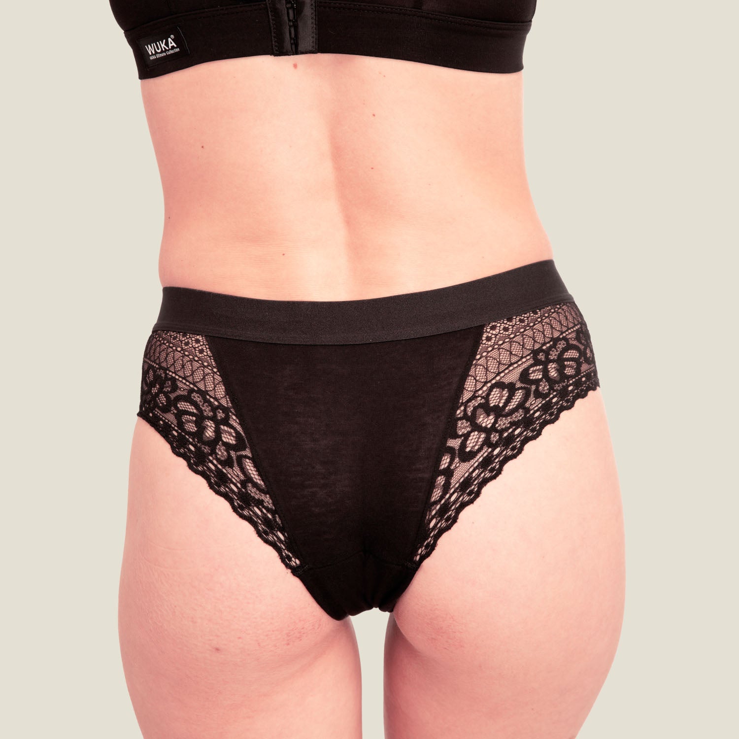 Rear view of WUKA Ultimate™ Lace Hipster Brief in black for medium flow, showcasing full bottom coverage and sleek back design for comfortable, secure period wear.