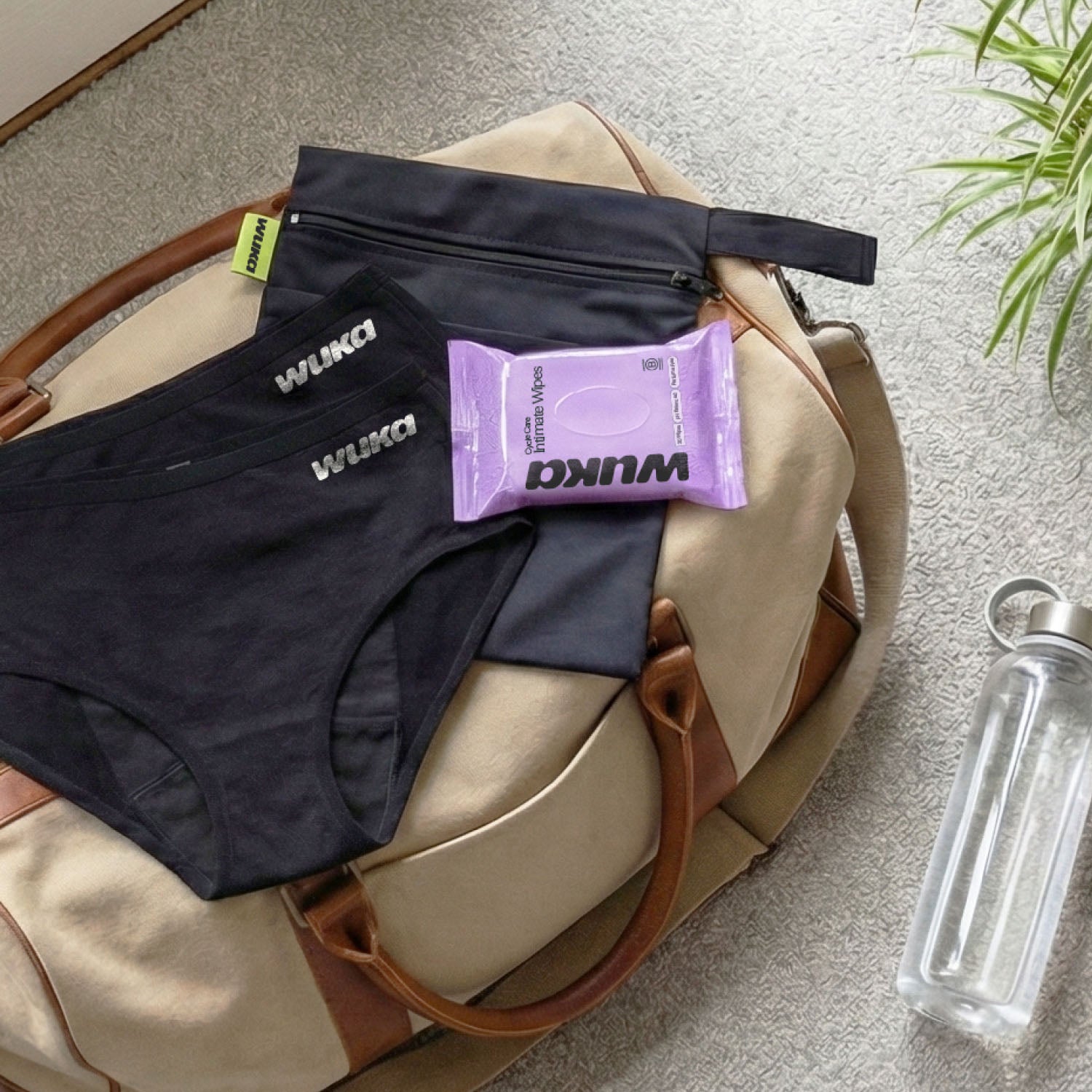 Flat lay of WUKA Go Bag contents displayed in a gym or travel bag, illustrating its convenience for work, workouts, or overnight stays