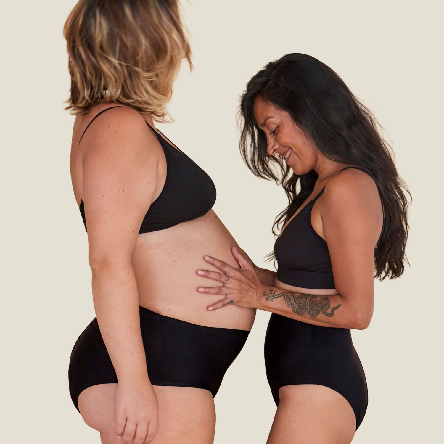 Lifestyle image of two women wearing the Drytech™ Incontinence Brief in black, demonstrating comfort, stretch, and inclusivity.